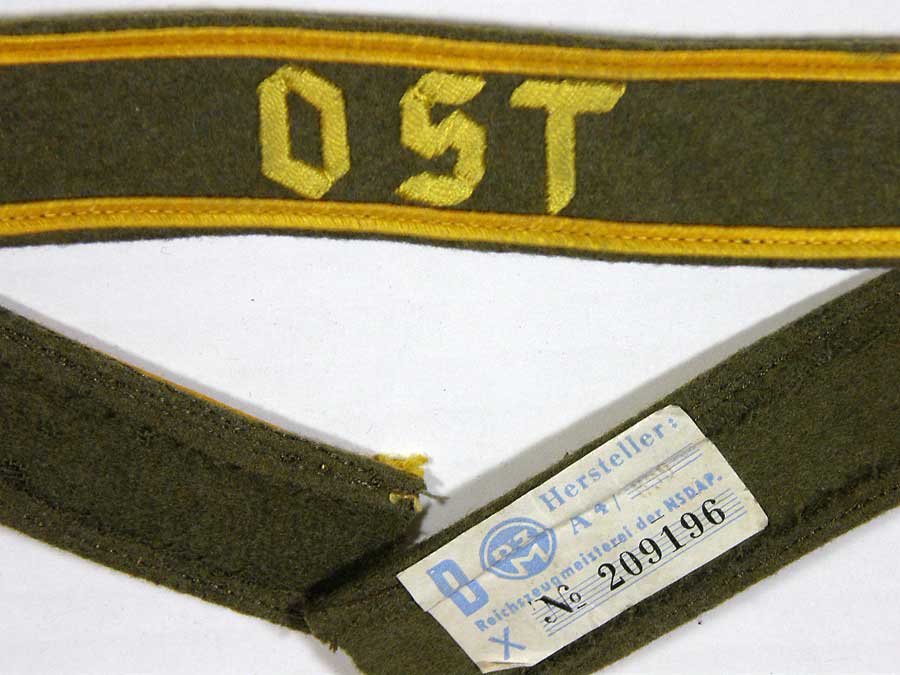 ost cufftitle in golden yellow hand embroidered thread with gold borders