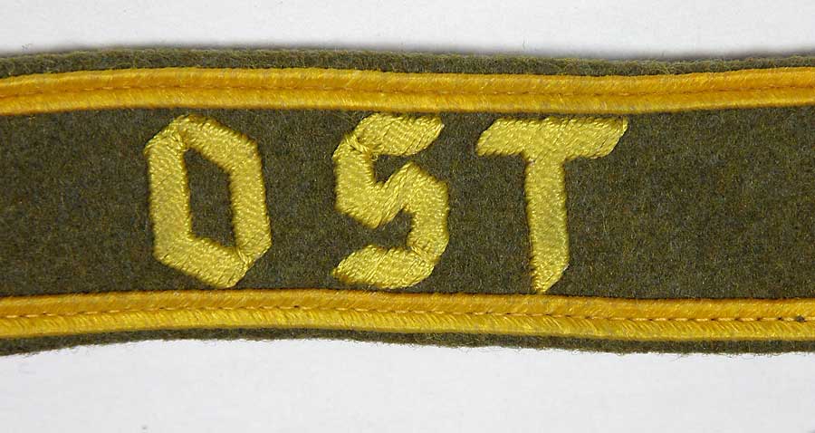 OST cufftitle in golden yellow hand embroidered thread with gold borders