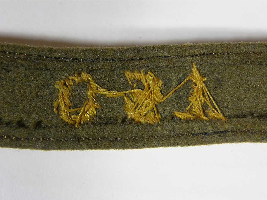 OST cufftitle in golden yellow hand embroidered thread with gold borders