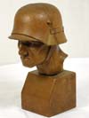 Wood carving bust of German soldier wearing helmet dated Okt. 1935