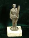 Luftwaffe pilot standing with propeller desk ornament on marbel base