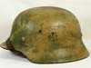 Army M40 combat helmet with green/tan camouflage pattern over tropical finish