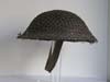Mint, un-issued British helmet with netting marked and dated 1940