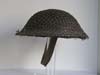 Mint, un-issued British helmet with netting marked and dated 1940
