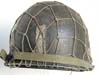 Army WWII M1 combat helmet worn by a 1st Lt. of the 29th Division with netting