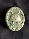 Gold Wound badge marked 127